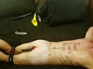 Humliliated faggot slave covered in degrading body writing